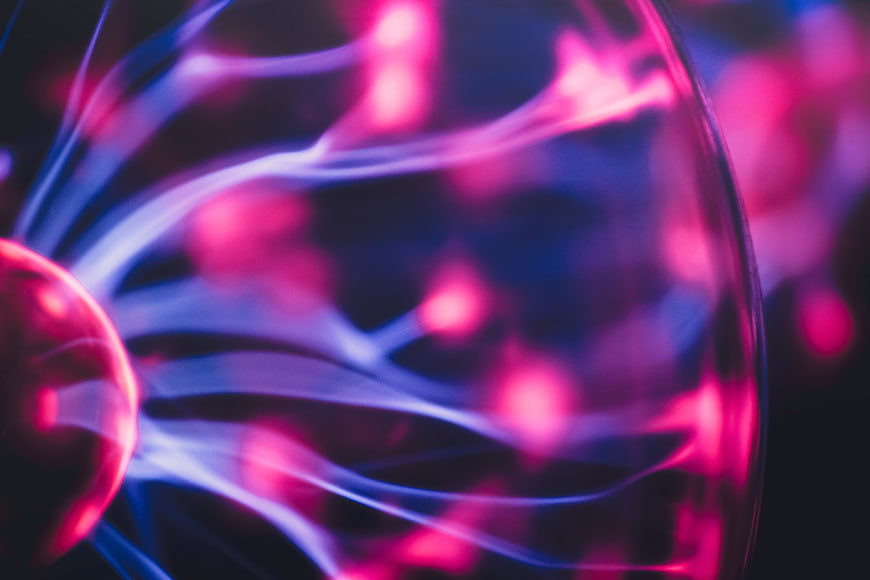 Abstract Plasma Ball with Neon Pink and Blue Lightning