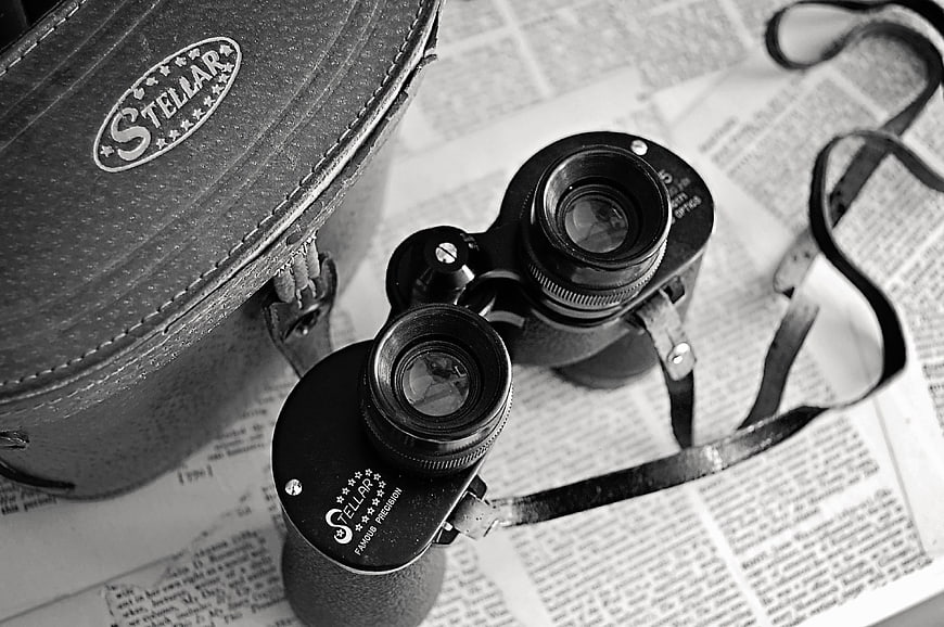 Vintage Stellar Binoculars on Newspaper