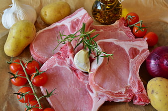 Raw Pork Chops with Fresh Vegetables and Herbs