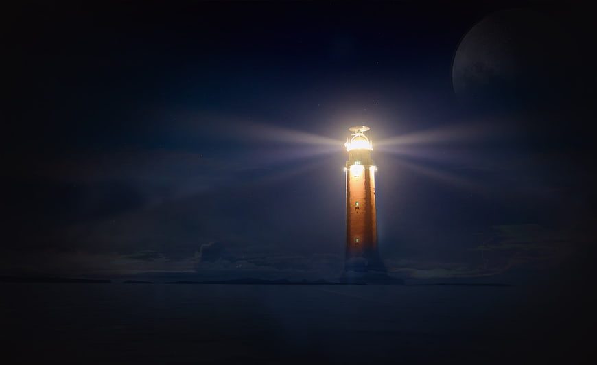 Lighthouse Beaming Light at Night with Moon