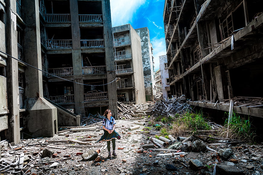 Girl in School Uniform Standing in Abandoned Battleship Island Ruins