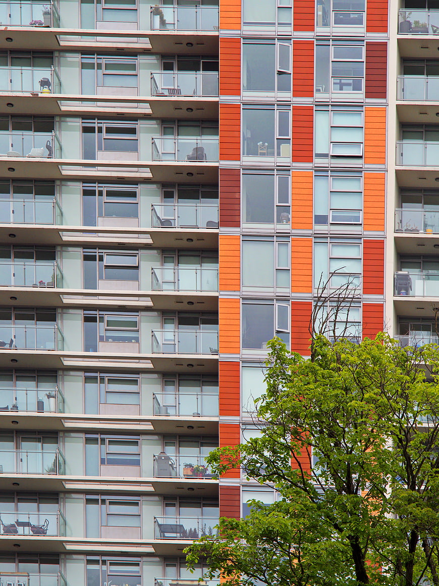 Modern Apartment Building Facade with Orange and Green Accents