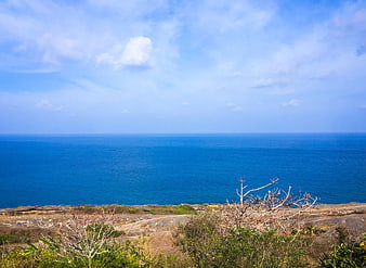 Scenic coastal landscape with blue ocean and sky
