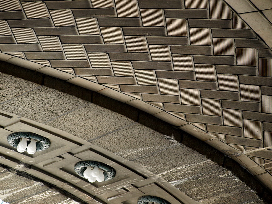 Abstract architectural ceiling detail with textured brick pattern and lights