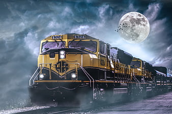 Dramatic Yellow Locomotive Under Full Moon And Stormy Night Sky