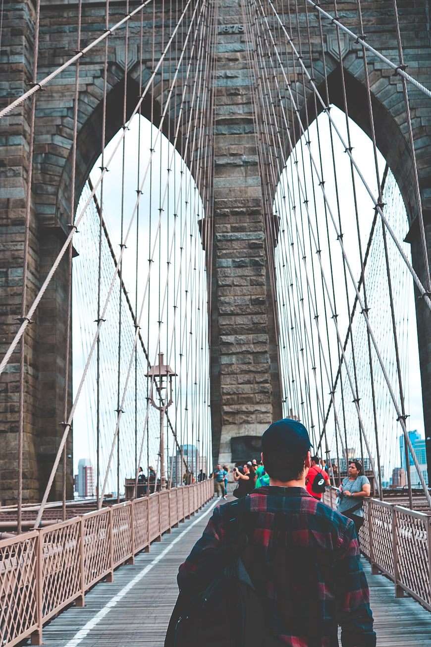 Man Walking on Brooklyn Bridge Pedestrian Path