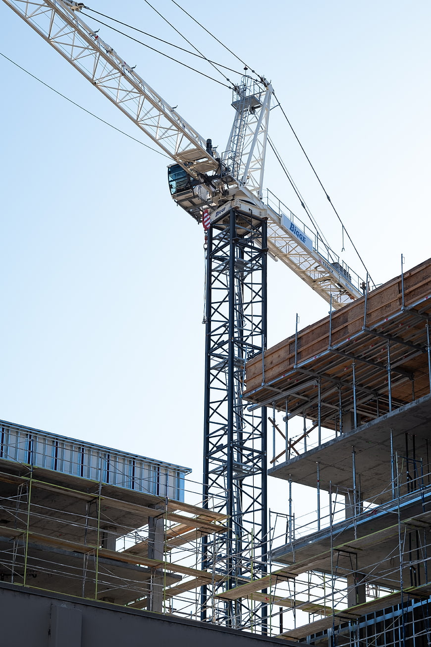 Tower Crane at Construction Site with Scaffolding