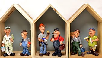 Caricature Construction Worker Figurines in Wooden House Frames
