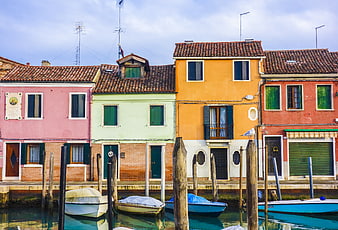 Colorful Venetian Houses Along a Canal with Moored Boats
