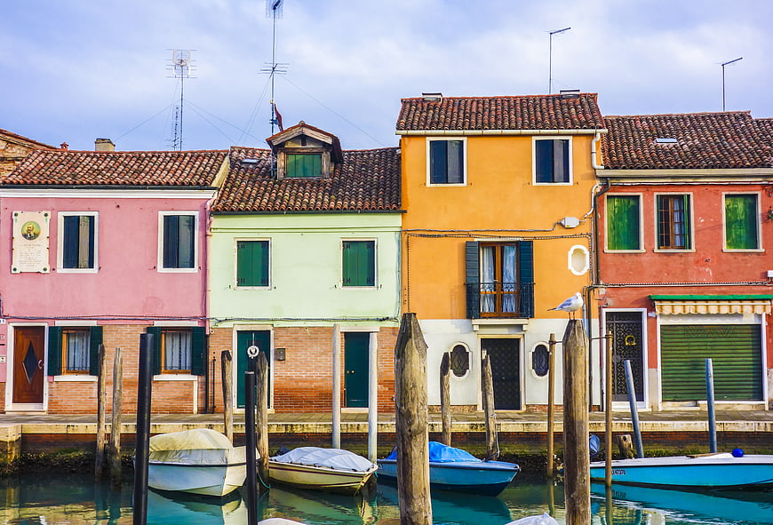 Colorful Venetian Houses Along a Canal with Moored Boats