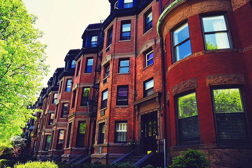 Low angle view of historic red brick brownstones in Boston