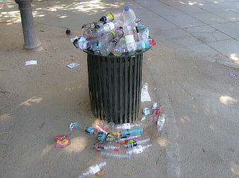 Overflowing Public Trash Bin With Plastic Bottles On Concrete Plaza