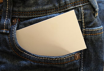 Blank white card in back pocket of blue jeans