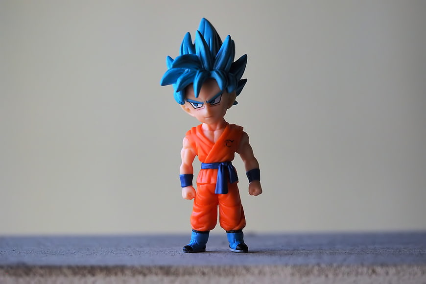 Super Saiyan Blue Goku Chibi Action Figure on Gray Background