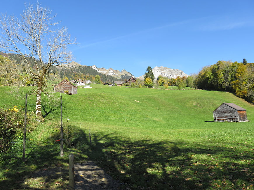 Scenic Swiss Alpine Pasture with Barns and Mountains
