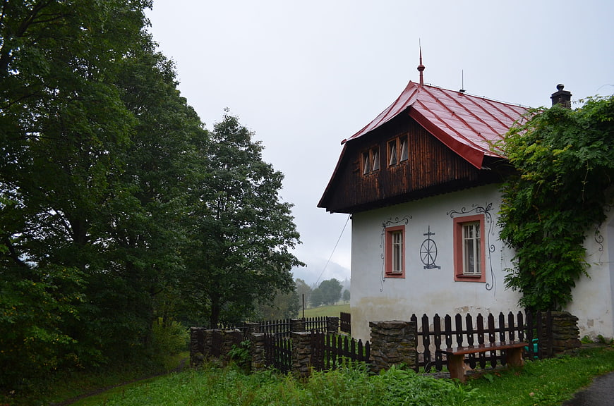 Traditional white house with red roof in Czech countryside