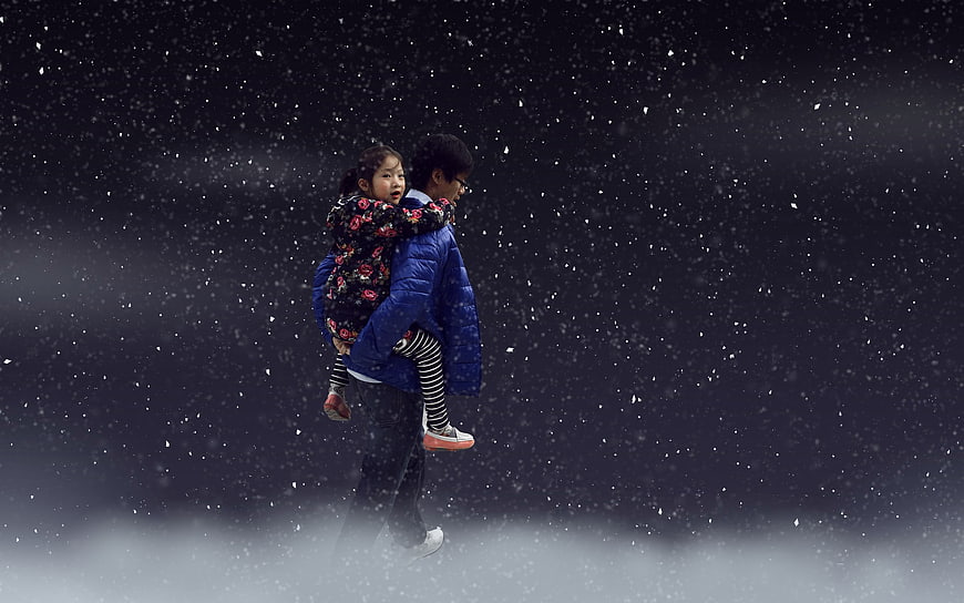 Man Carrying Girl In Snowy Night