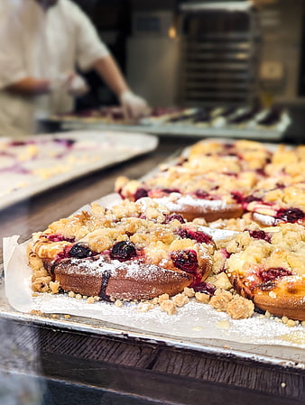 Freshly baked Czech kolache pies with berry filling and crumble topping