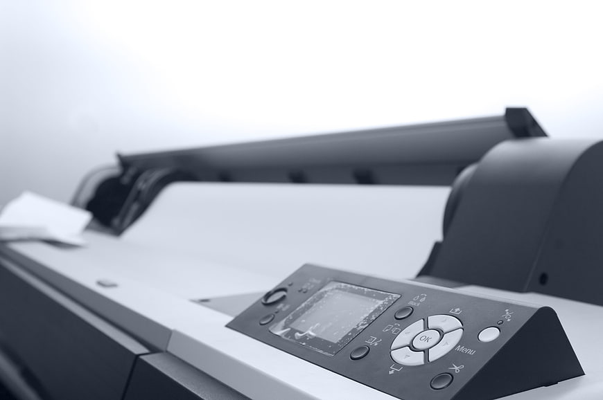 Close-up of large format printer control panel and paper feed