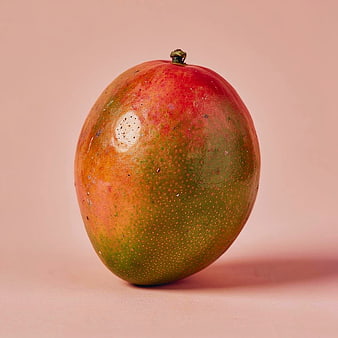 Fresh Ripe Mango on Solid Pink Background