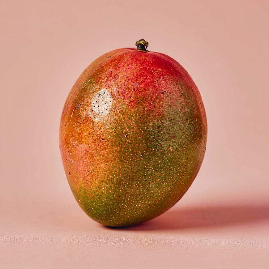 Fresh Ripe Mango on Solid Pink Background
