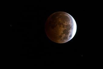 Partial Lunar Eclipse with Bright Crescent and Dark Shadow