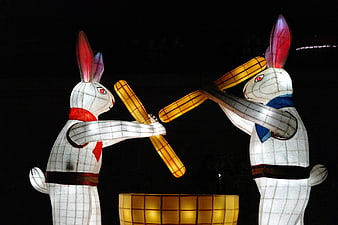 Traditional Korean Rabbit Lanterns Fighting With Sticks At Night