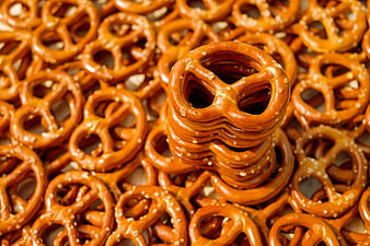 Stack of Salty Pretzels on a Bed of Snacks
