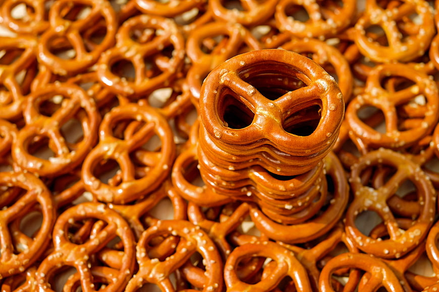 Stack of Salty Pretzels on a Bed of Snacks