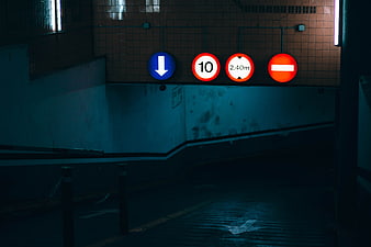 Dark Underground Parking Garage With Traffic Signs