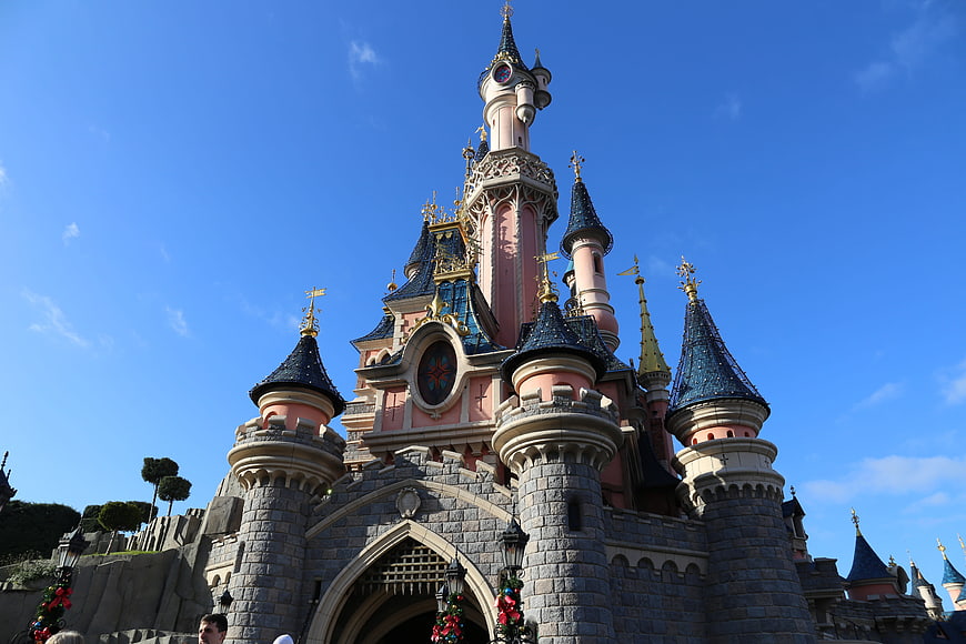 Low angle view of Disneyland Paris castle against blue sky