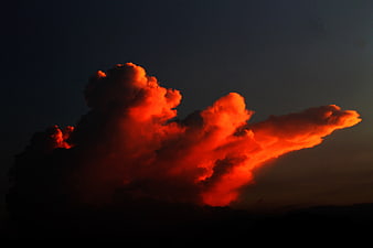 Dramatic Red Sunset Clouds Against Dark Sky