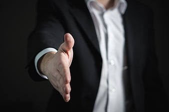 Businessman Handshake Offer in Suit