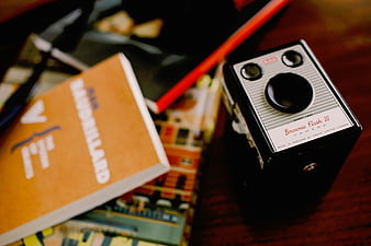 Vintage Kodak Brownie Flash III Camera on Wooden Desk