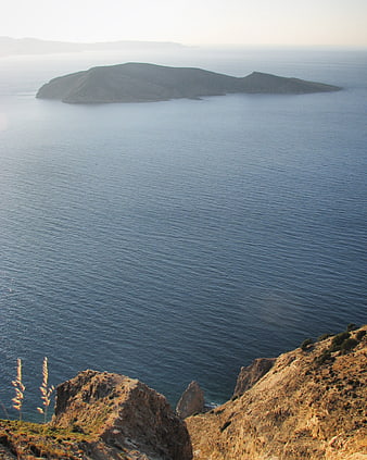 Scenic View of a Rocky Island in the Calm Blue Sea