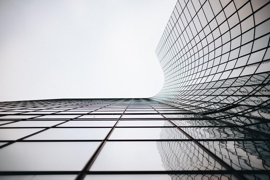 Low angle view of modern glass skyscraper architecture