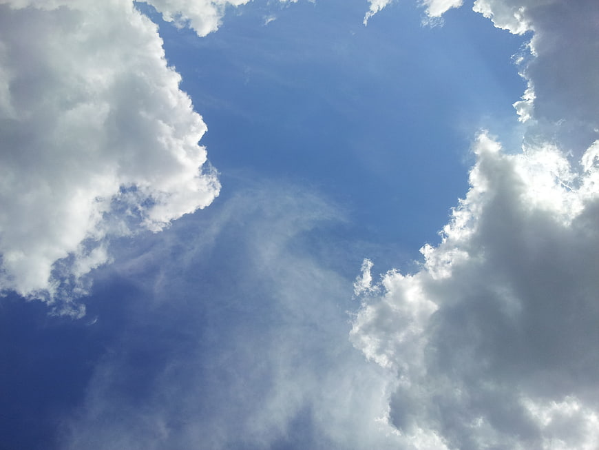 Blue Sky with White Clouds and Sunlight