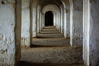 Ancient Stone Archway Corridor Leading To Dark Interior