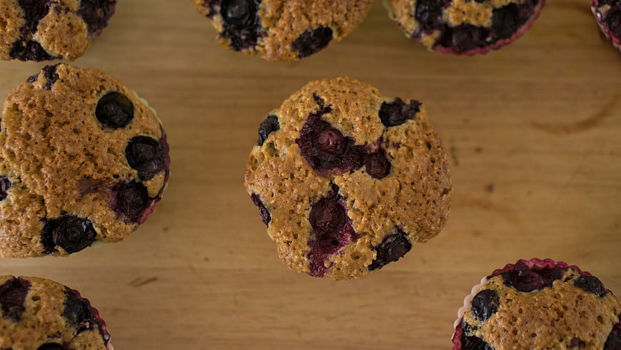 Fresh Blueberry Muffins on Wooden Surface