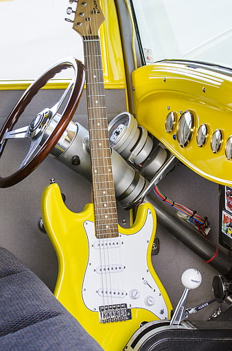 Yellow Electric Guitar Inside Classic Hot Rod Car Interior