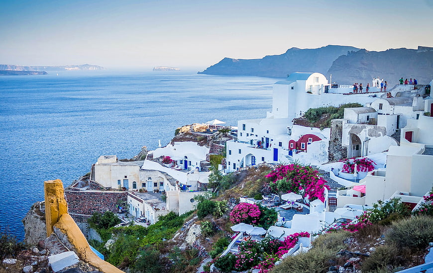 Santorini Oia Cliffside Village with Blue Sea and Bougainvillea