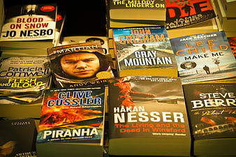 Stacks of bestselling thriller novels on bookstore shelf