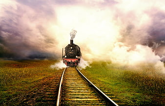 Vintage Steam Train on Tracks in Misty Landscape