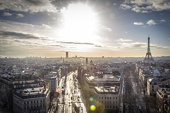 Paris Skyline with Eiffel Tower and Sun Flare