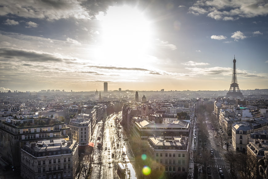 Paris Skyline with Eiffel Tower and Sun Flare