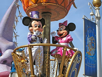 Mickey and Minnie Mouse on a parade float at Disneyland Paris
