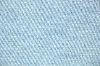 Close-up texture of light blue denim fabric background
