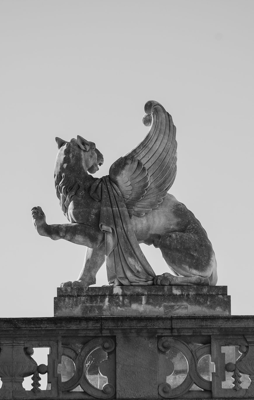 Black and white photo of winged lion statue in Marseille