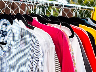 Colorful Shirts Hanging on Outdoor Clothing Rack