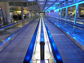Futuristic Airport Moving Walkway With Blue Neon Lighting